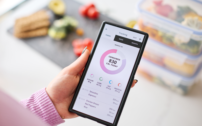 Calorie Counting close up of woman looking at calorie counting app